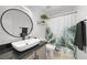 Contemporary bathroom featuring a vessel sink, granite counters, and fresh greenery at 917 Boulder Springs Dr # 202, Las Vegas, NV 89128