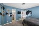 Cozy bedroom showcasing unique wall art and seamless access to bathroom at 917 Boulder Springs Dr # 202, Las Vegas, NV 89128