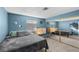 Relaxing bedroom with blue walls, soft carpet, and a mirrored closet at 917 Boulder Springs Dr # 202, Las Vegas, NV 89128