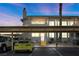 Exterior view of the condo building showing assigned parking and well-kept landscaping at 917 Boulder Springs Dr # 202, Las Vegas, NV 89128