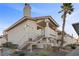 Well-maintained exterior of a condo featuring stairs leading to the upper-level units at 917 Boulder Springs Dr # 202, Las Vegas, NV 89128