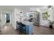 Charming kitchen with blue cabinetry, stainless steel appliances, and granite countertops at 917 Boulder Springs Dr # 202, Las Vegas, NV 89128
