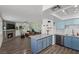 Open floorplan with a fireplace, leather couch, and a kitchen island with seating at 917 Boulder Springs Dr # 202, Las Vegas, NV 89128