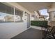 Charming covered patio with seating and a landscaped view at 917 Boulder Springs Dr # 202, Las Vegas, NV 89128