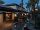 Elegant backyard featuring private pool, and arched loggia for outdoor living at 9325 Canyon Classic Dr, Las Vegas, NV 89144