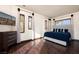 Sunlit bedroom features hardwood floors, neutral tones, and a mounted TV at 9325 Canyon Classic Dr, Las Vegas, NV 89144
