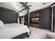 This primary bedroom has a king bed, built-in storage and a view to the yard at 9325 Canyon Classic Dr, Las Vegas, NV 89144