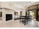 Dining area with a fireplace, a bar counter, and an outdoor view at 9325 Canyon Classic Dr, Las Vegas, NV 89144