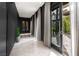 Bright hallway with natural light and elegant drapery leading to the outdoors at 9325 Canyon Classic Dr, Las Vegas, NV 89144