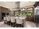 Kitchen featuring granite countertops, stainless steel appliances, island and pendant lights at 9325 Canyon Classic Dr, Las Vegas, NV 89144