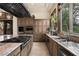 Gourmet kitchen featuring an island cooktop and stainless-steel appliances at 9325 Canyon Classic Dr, Las Vegas, NV 89144