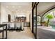 Beautiful kitchen bar top opens to an outdoor living space and pool area at 9325 Canyon Classic Dr, Las Vegas, NV 89144