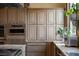 Kitchen with custom cabinetry, stainless steel appliances and granite counters at 9325 Canyon Classic Dr, Las Vegas, NV 89144