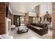 Open concept living area with high ceilings, stone accents, and natural light at 9325 Canyon Classic Dr, Las Vegas, NV 89144