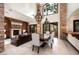 Bright living area featuring modern lighting, dining space, and courtyard access at 9325 Canyon Classic Dr, Las Vegas, NV 89144