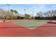 Well-maintained community tennis court provides a place for recreation surrounded by beautiful mature landscaping at 9325 Canyon Classic Dr, Las Vegas, NV 89144