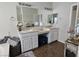 Bathroom featuring dual sinks, a vanity area, and a large mirror at 10276 Romantico Dr, Las Vegas, NV 89135