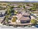 Expansive home features lush landscaping, a sparkling pool, and a well-manicured lawn in a serene setting at 11 Canoa Hills Dr, Henderson, NV 89052