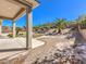 Expansive backyard with palm trees and decorative landscaping at 11 Canoa Hills Dr, Henderson, NV 89052