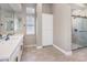 Modern bathroom with double vanity, glass shower, and storage at 11 Canoa Hills Dr, Henderson, NV 89052