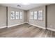 An inviting room with natural light, stylish shuttered windows, and laminate flooring at 11 Canoa Hills Dr, Henderson, NV 89052