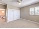 Neutral bedroom boasting carpeted floor, double closets, and natural light at 11 Canoa Hills Dr, Henderson, NV 89052