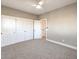 Neutral bedroom featuring carpeted floor, ceiling fan, and large closet space at 11 Canoa Hills Dr, Henderson, NV 89052