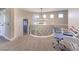 Upstairs hallway with unique railing and a distant view of chandelier at 11 Canoa Hills Dr, Henderson, NV 89052