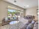Bright living room with a large sliding door that opens to the backyard at 11 Canoa Hills Dr, Henderson, NV 89052