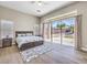 Main bedroom featuring a large window with backyard views at 11 Canoa Hills Dr, Henderson, NV 89052