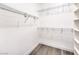 Spacious walk-in closet with wire shelving and wood-style flooring at 11 Canoa Hills Dr, Henderson, NV 89052