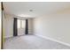 Bedroom featuring neutral carpet, window with curtains, and ample natural light at 1201 Sulphur Springs Ln # 101, Las Vegas, NV 89128