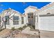 Close-up of the front entrance, showcasing the address, walkway, and well-maintained landscaping at 1590 Raining Hills St, Henderson, NV 89052