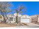 Attractive single-story residence with a well-manicured front yard and a convenient two-car garage at 1590 Raining Hills St, Henderson, NV 89052