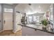 Open-concept kitchen with modern appliances, granite countertops, and a breakfast bar at 1590 Raining Hills St, Henderson, NV 89052