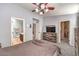 The main bedroom showcasing access to an en-suite bathroom and a spacious walk-in closet at 1590 Raining Hills St, Henderson, NV 89052
