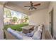 Comfortable covered patio with stylish furniture and view of the manicured backyard at 1590 Raining Hills St, Henderson, NV 89052