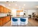 Spacious kitchen with an island, granite countertops, and wood cabinets at 1653 Sun Canyon Ct, Las Vegas, NV 89128