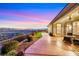 Extended back patio with a golf course view and artificial turf at 2062 Dipinto Ave, Henderson, NV 89052