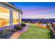 Expansive backyard with artificial turf, putting green, and panoramic views at 2062 Dipinto Ave, Henderson, NV 89052