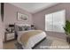 Calm bedroom featuring a large window, soft lighting, and neutral decor at 2062 Dipinto Ave, Henderson, NV 89052