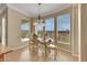 Sunlit dining area with picturesque views and charming decor at 2062 Dipinto Ave, Henderson, NV 89052