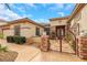 Stylish home featuring a decorative iron gate and meticulously kept landscaping at 2062 Dipinto Ave, Henderson, NV 89052