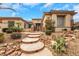 Beautiful home featuring a stone pathway and vibrant desert landscaping at 2062 Dipinto Ave, Henderson, NV 89052