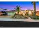 Charming single-story home with manicured front yard landscaping and a three-car garage at 2062 Dipinto Ave, Henderson, NV 89052