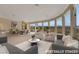 Open-concept living room with a view and stylish seating arrangements at 2062 Dipinto Ave, Henderson, NV 89052