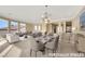 Well-lit living and dining area featuring stylish furnishings and neutral tones at 2062 Dipinto Ave, Henderson, NV 89052