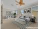 Spacious bedroom featuring a seating area, plush carpet, and ample natural light at 2062 Dipinto Ave, Henderson, NV 89052