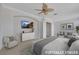 Stylishly decorated bedroom with seating area, TV, and ample closet space at 2062 Dipinto Ave, Henderson, NV 89052