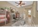 Bright office space with a glass desk, ceiling fan, and a view into other rooms at 2062 Dipinto Ave, Henderson, NV 89052